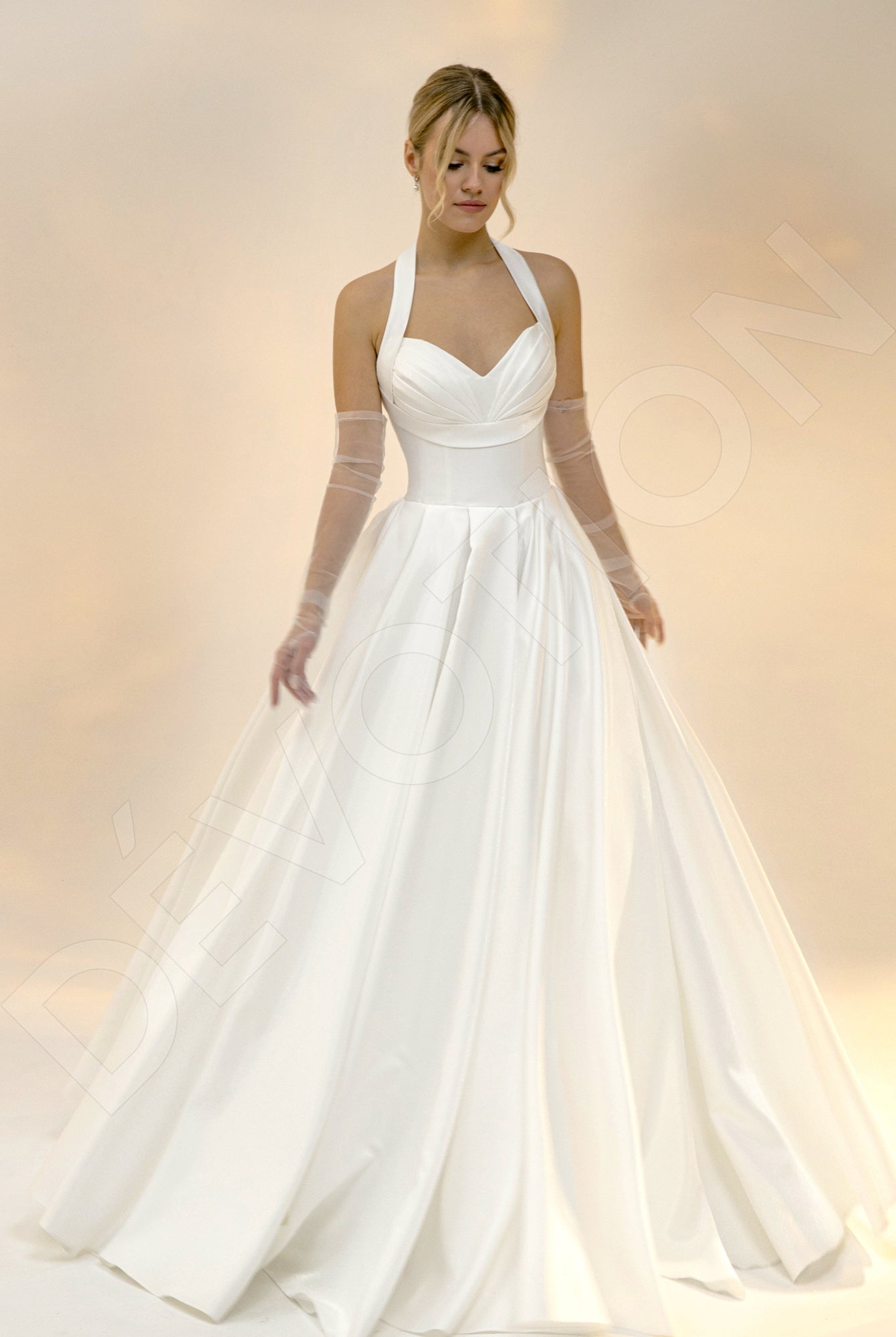 The Briggie A-line Sweetheart gown in light ivory, with its delicate allure, inspires visions of a serene honeymoon, perhaps a quiet escape to a secluded resort.