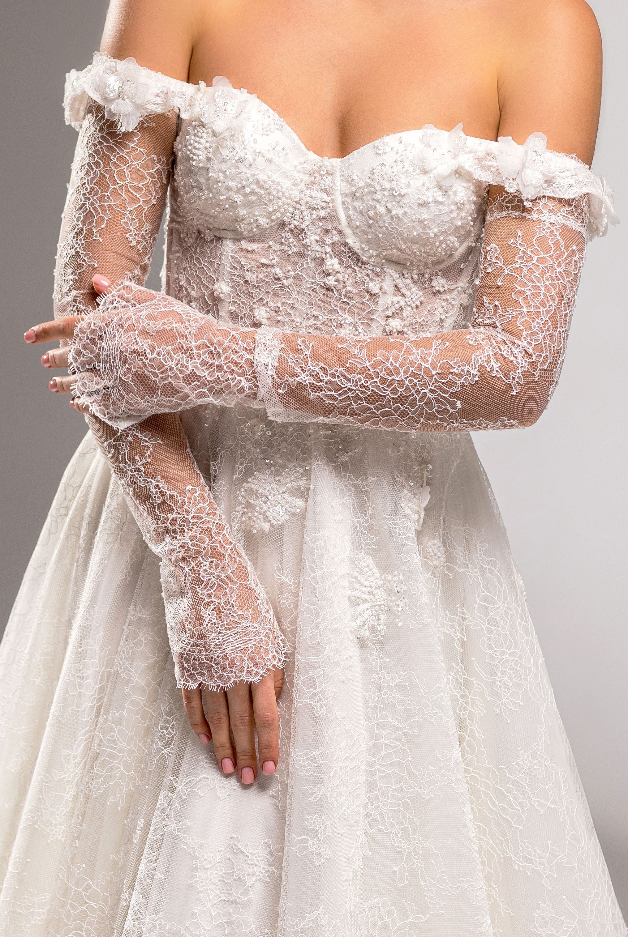 charlize lace strapless dress The Charlize lace bodice with a translucent effect has a sweetheart neckline, visible bones, decorative lacing on the back over the zipper, and most importantly, an unusual cut that covers the sides