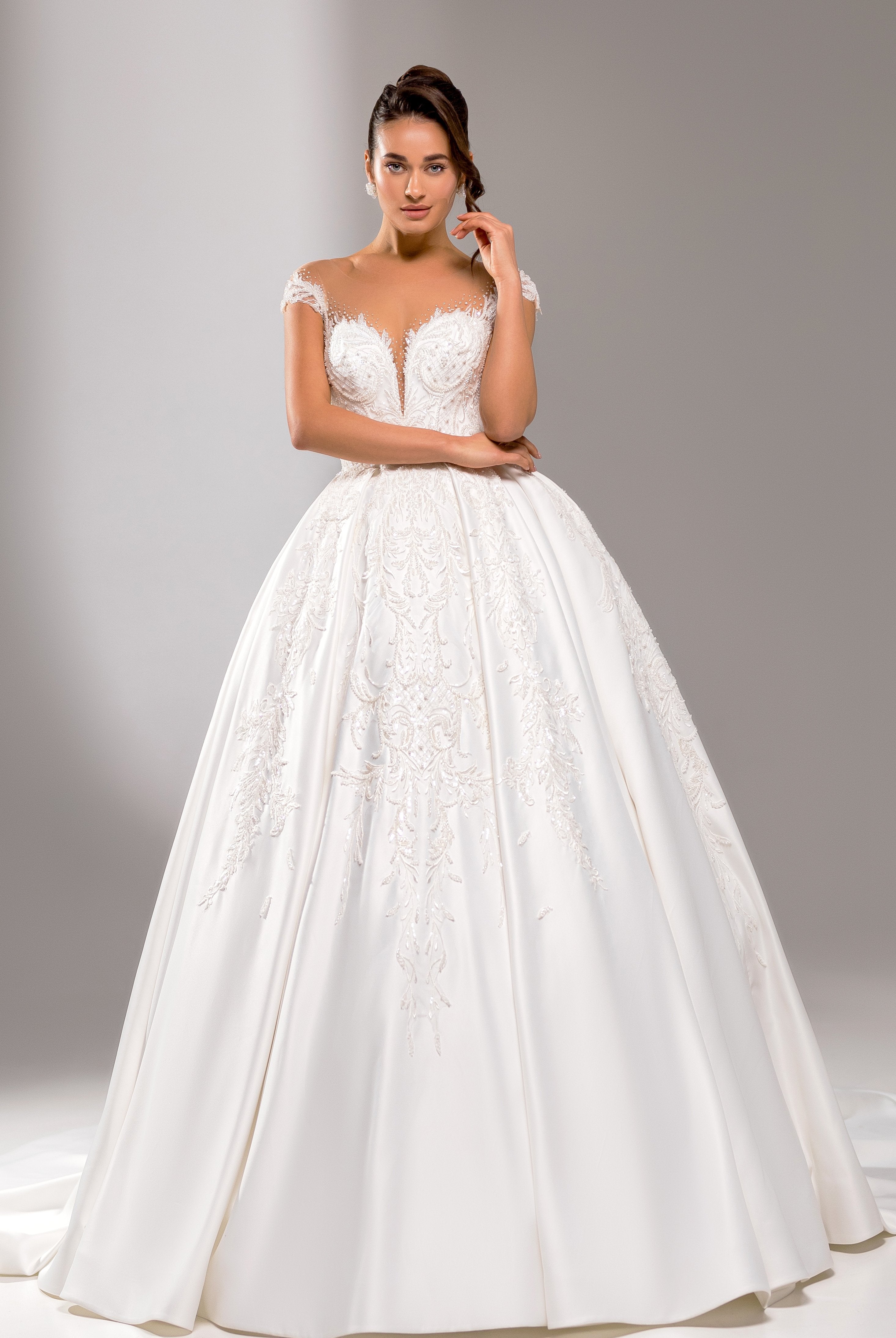 A bride in the Halston Princess/Ball Gown Illusion Milk Wedding dress
