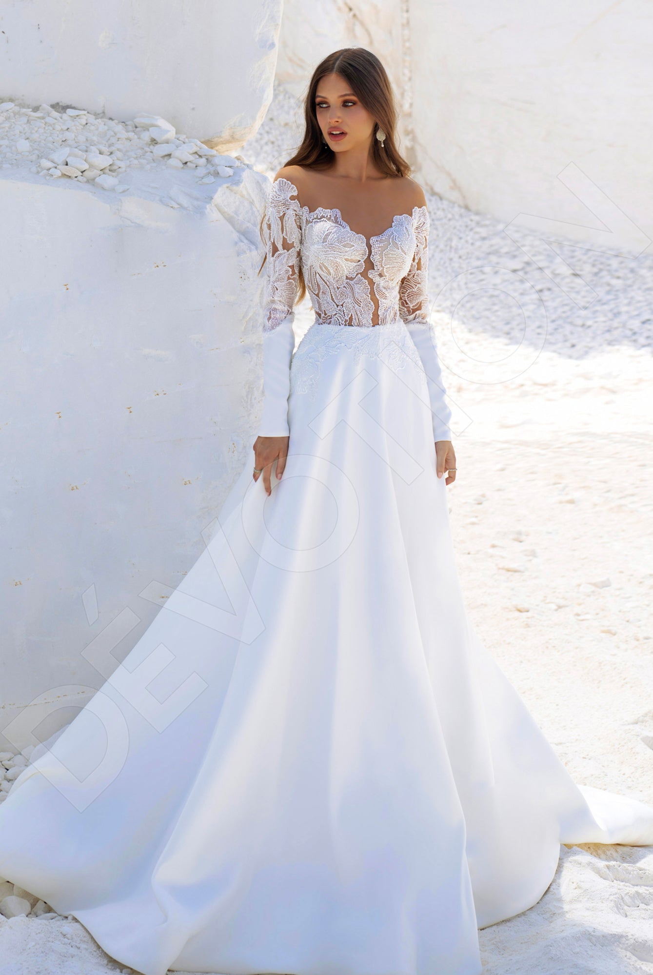 A bride in the Josie A-line Illusion Ivory Wedding dress