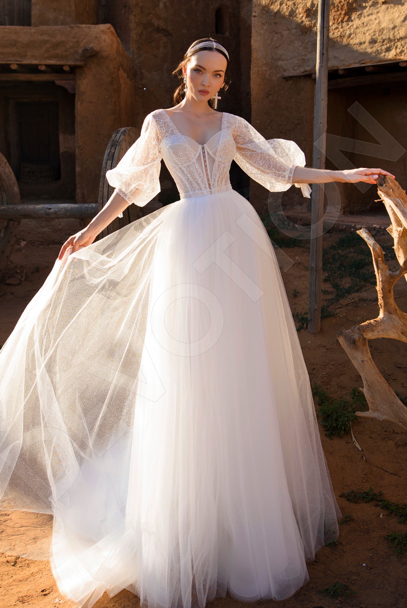 A bride in the Savantia A-Line Sweetheart Off White Wedding dress, showcasing the elegant neckline